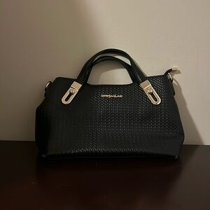 M X JaoLan | Black Purse textured surface